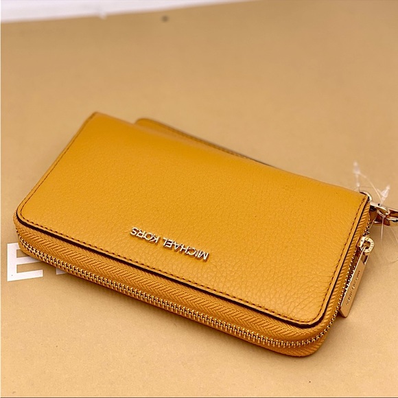Michael Kors Handbags - Michael Kors Jet Set Travel Phone Case Wristlet Wallet Marigold